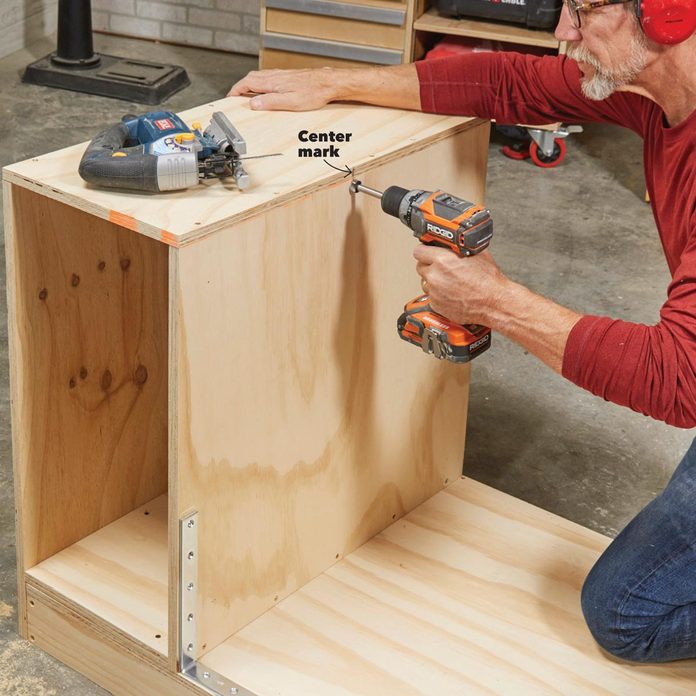 drill the pivot holes in flip-top bench