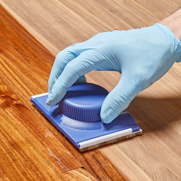 Paint pad spreading poly finish on wood | Construction Pro Tips