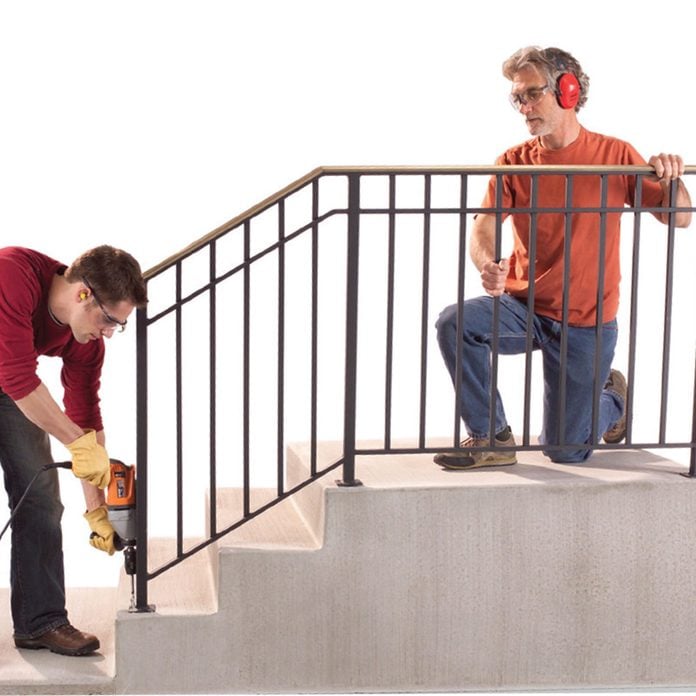 installing iron handrail exterior steps