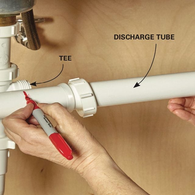 Replace a Garbage Disposal prepare for a new discharge tube