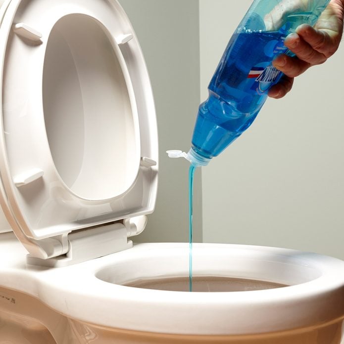 Unclog a toilet with dish soap