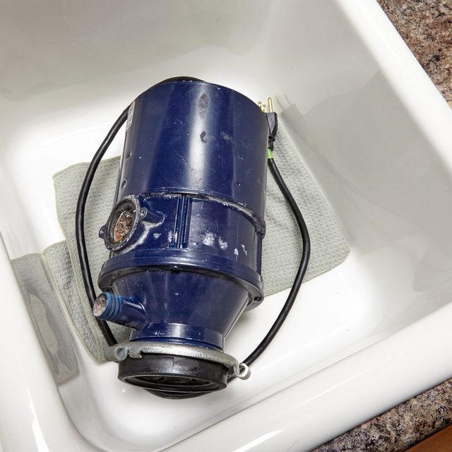 Replace a Garbage Disposal Weigh down the sink flange