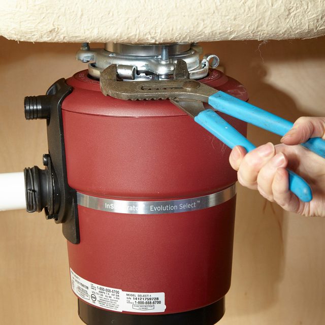 Replace a Garbage Disposal tighten with pliers