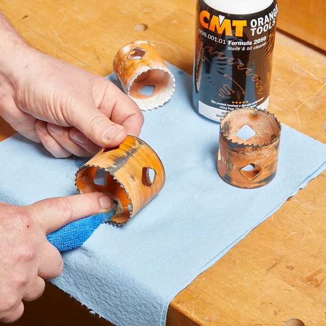 Cleaning hole saws with a cloth and cleaning formula | Construction Pro Tips