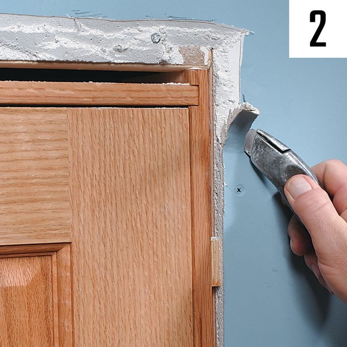 Cutting back drywall around door casing | Construction Pro Tips