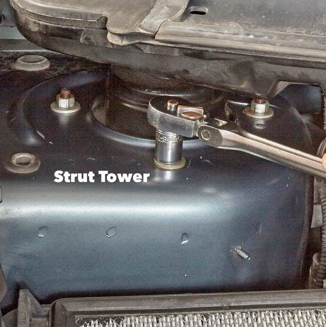 Remove the strut mount nuts