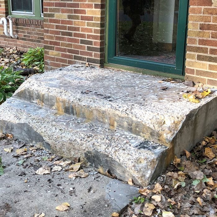 A worn-down old concrete step | Construction Pro Tips