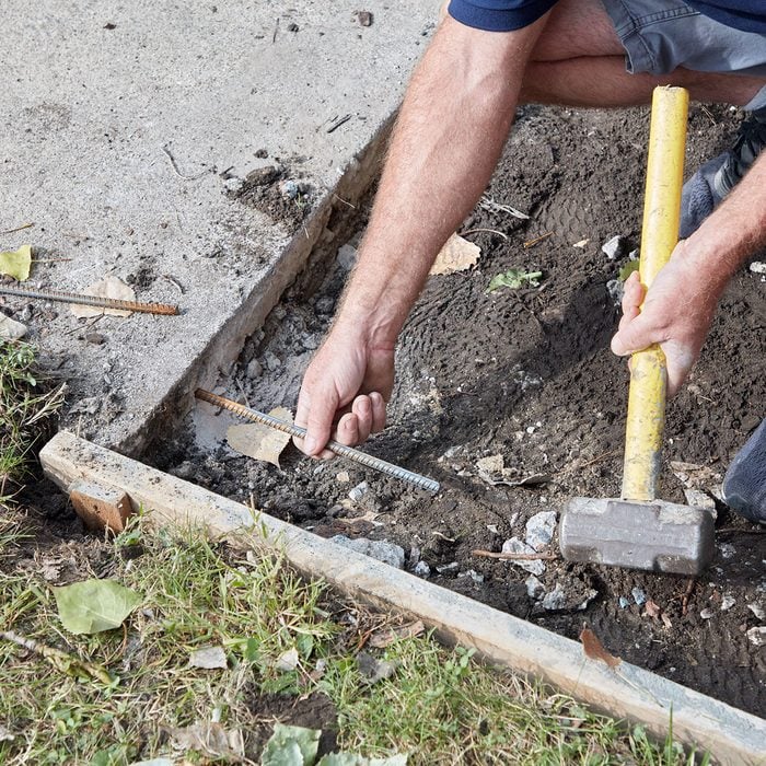 Tying into the existing sidewalk with rebar | Construction Pro Tips