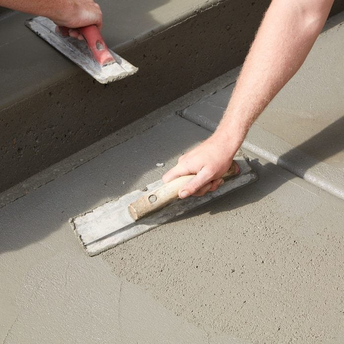 Smoothing out concrete and filling in voids | Construction Pro Tips