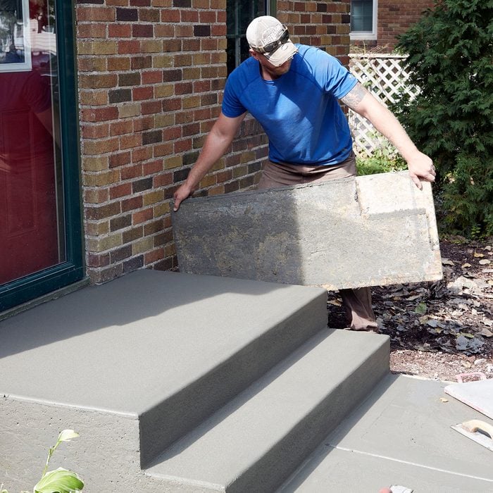 Pulling the side forms when the step is dry enough | Construction Pro Tips