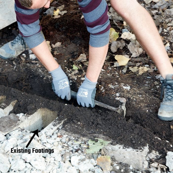 Digging a trench with a hammer for footings | Construction Pro Tips