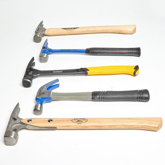 Five hammers laying on their sides