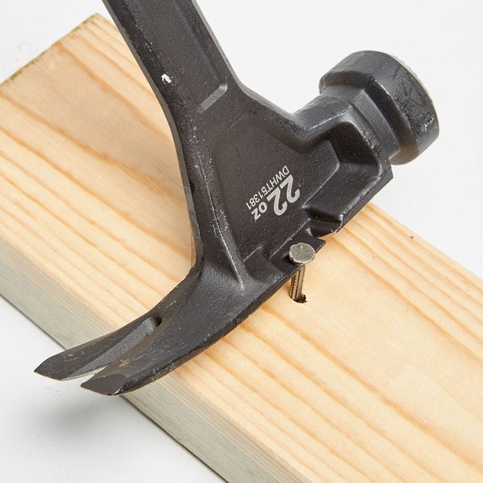 Nail being pulled by hammer with side-puller | Construction Pro Tips
