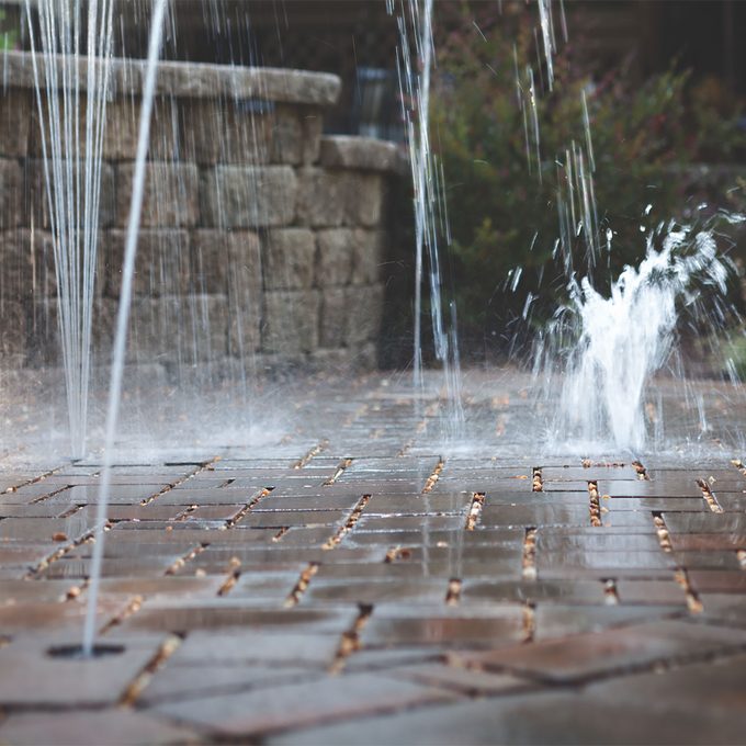 Water shooting up between cracks in the pavers | Construction Pro Tips