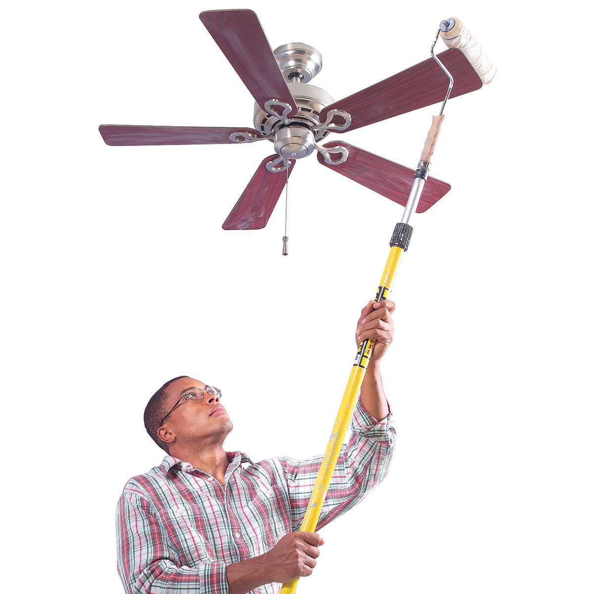 Dusting a ceiling fan with a paint roller | Construction Pro Tips