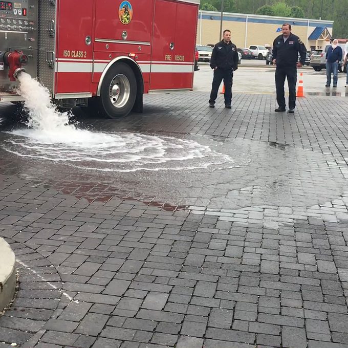 Firetruck dumping water on pavers | Construction Pro Tips