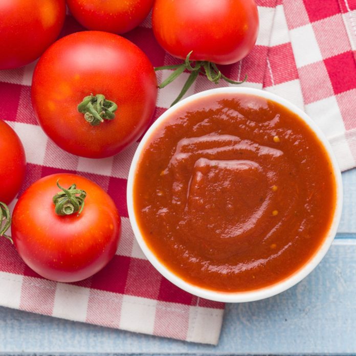 Tomatoes and ketchup. Top view.; Shutterstock ID 1154678266