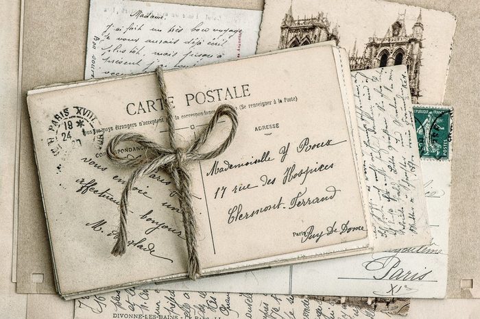 old letters and antique french postcards. vintage sentimental retro style background
