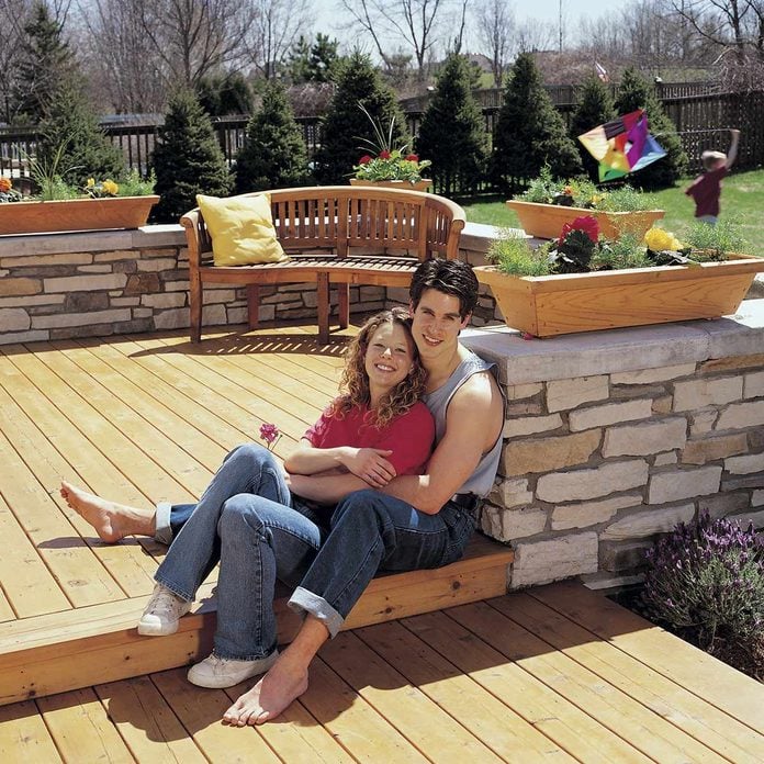 deck with stone wall