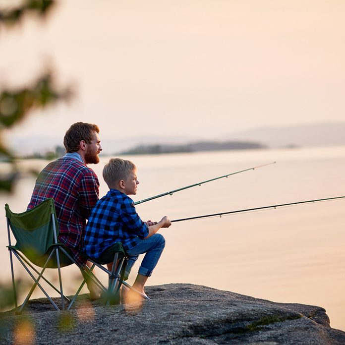 father and son fishing camping
