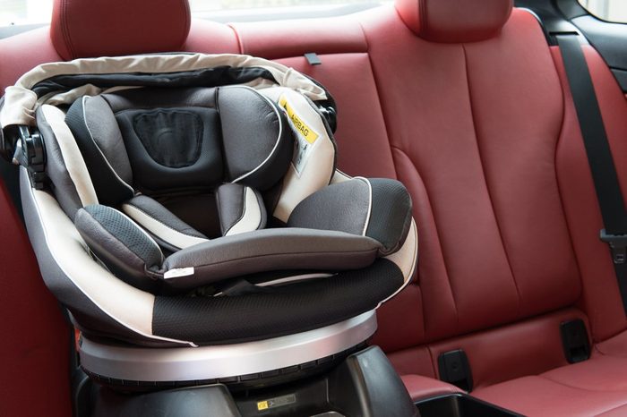car seat placing in luxury sport car. baby safety concept.