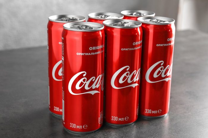 Cans of Coca-Cola on table
