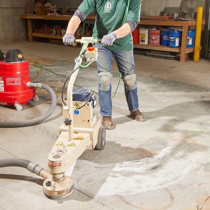 Operating a grinder on an uneven concrete slab | Construction Pro Tips