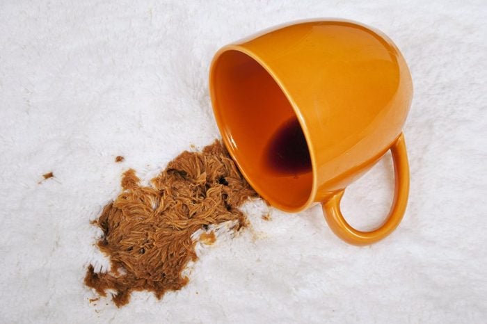 Cup Of Coffee Spilled On Carpet/ Spilled Coffee On White