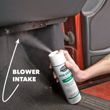 aerosol can sprays smell remover into car blower intake