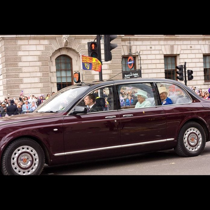 Queen Elizabeth rides in a Bentley