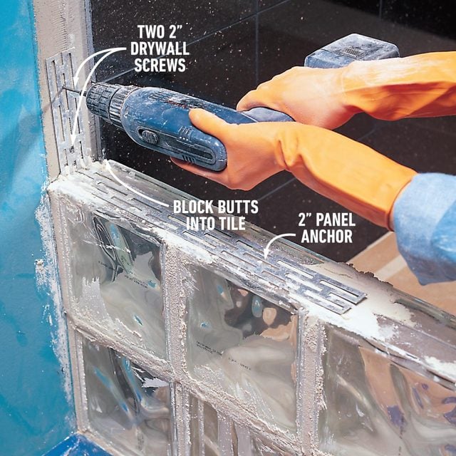 anchoring the glass block to the wall to install a glass block shower