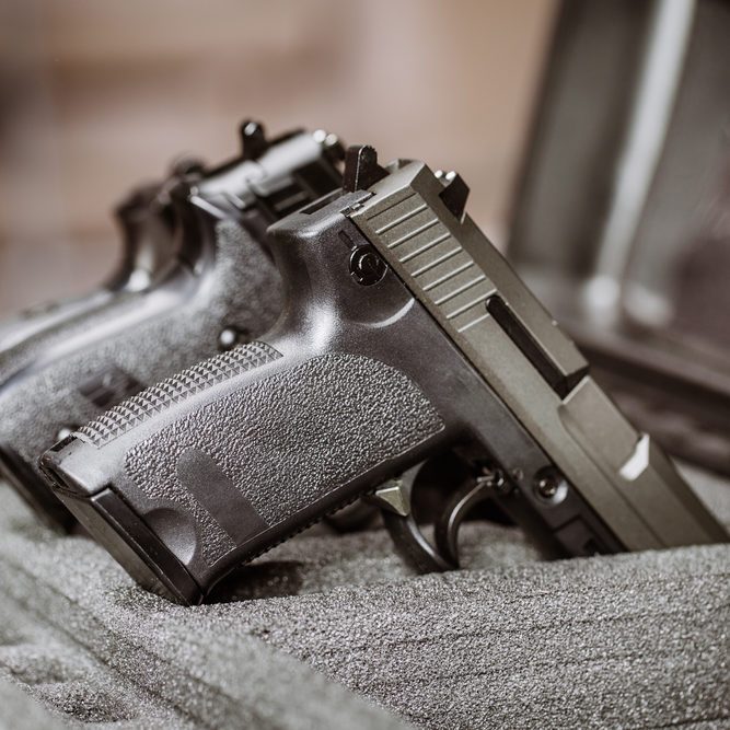 black handgun in plastic Secure Storage Case