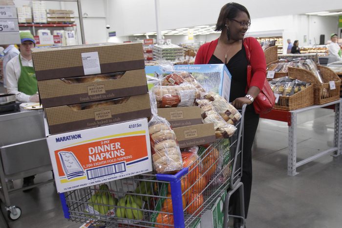 Shopper Leslie Corridon pushes a cart at a Sam's Club store in Rogers, Ark