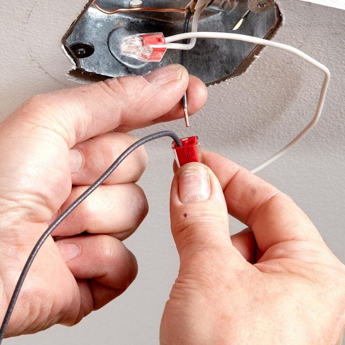 How To Replace A Light Fixture Diy Family Handyman - Replacing Ground Wire Ceiling Light