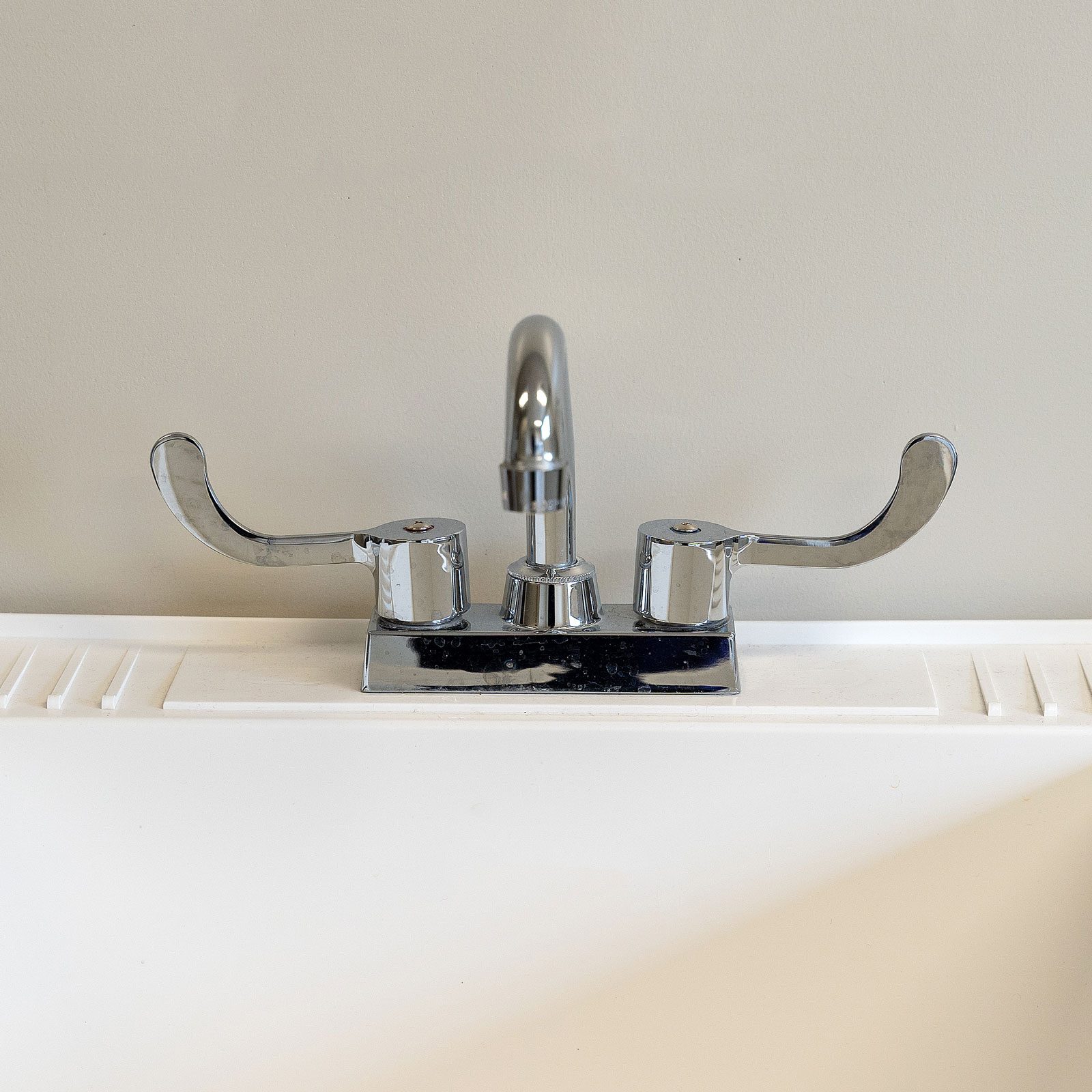 How to Fix a Leaking Faucet in the Laundry Room | Family Handyman