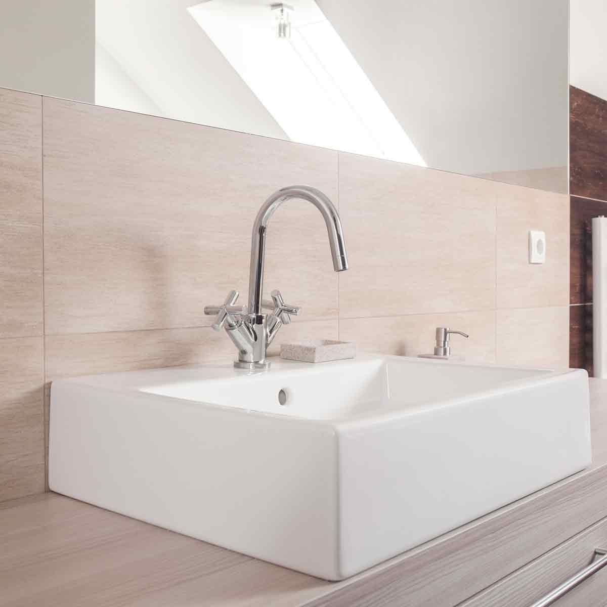 Neutral-colored-bathroom-with-Square-ceramic-sink-and-shiny-chrome-faucet