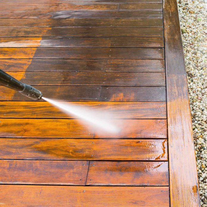 Pressure-washing-a-deck