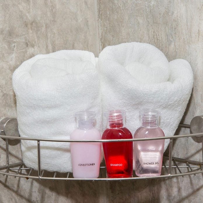 Shower caddy with soap, shampoo and two towels