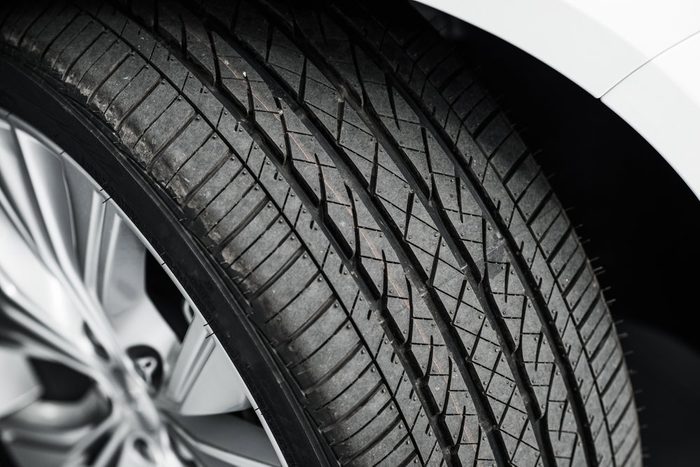 Brand New Car Tire Closeup Photo. Modern Car Tire