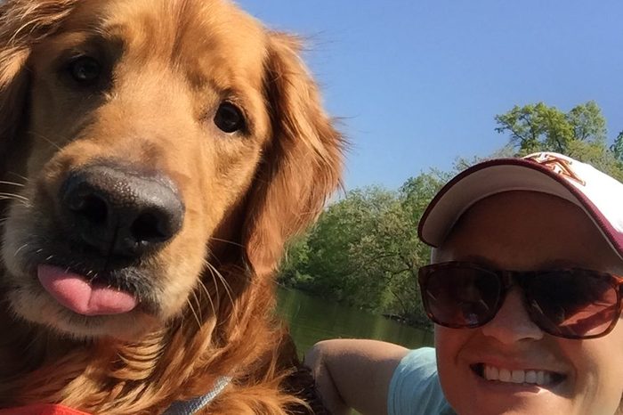 Selfie of woman with her dog on a boat