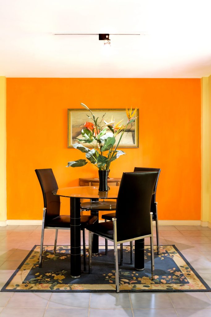 dining room on orange wall background