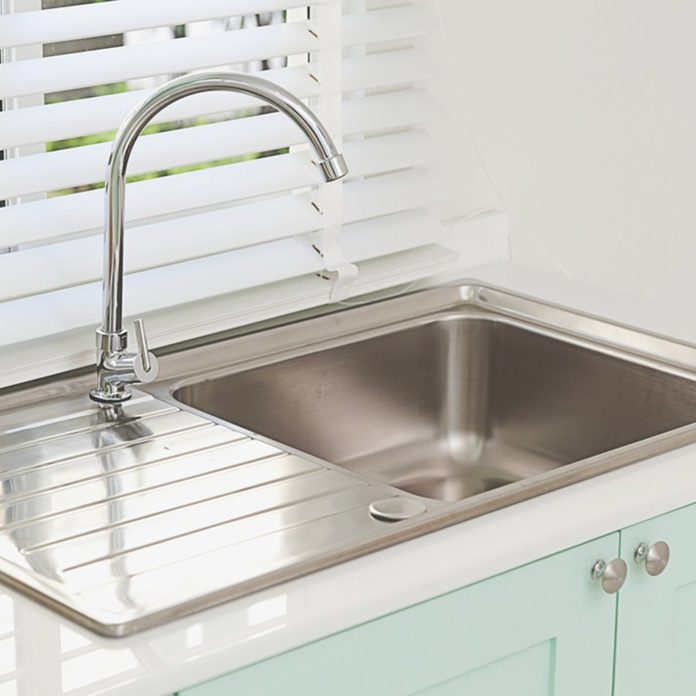Modern kitchen sink, green tone; Shutterstock ID 507453130