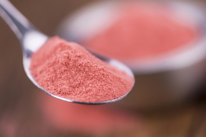 Fresh made Strawberry powder on an old and rustic wooden table; selective focus; close-up shot