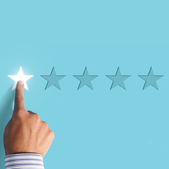 Hand choosing 1 star rating on blue background - negative feedback concept; Shutterstock ID 1129346567; Job (TFH, TOH, RD, BNB, CWM, CM): RD