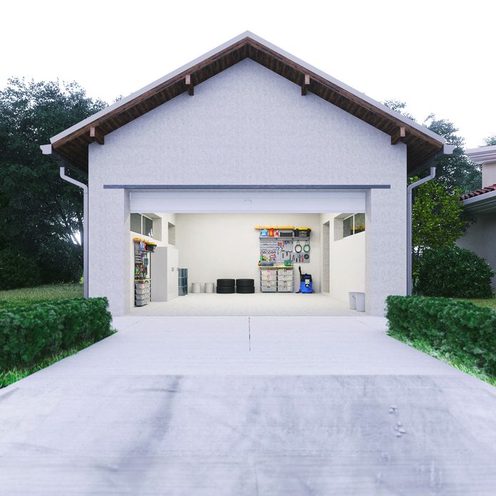 open garage with concrete driveway