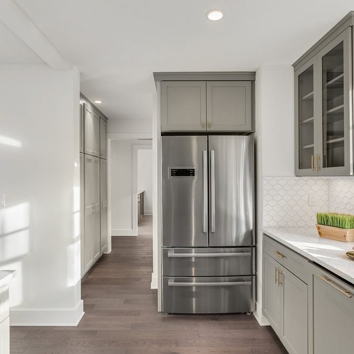Kitchen with metallic fridge