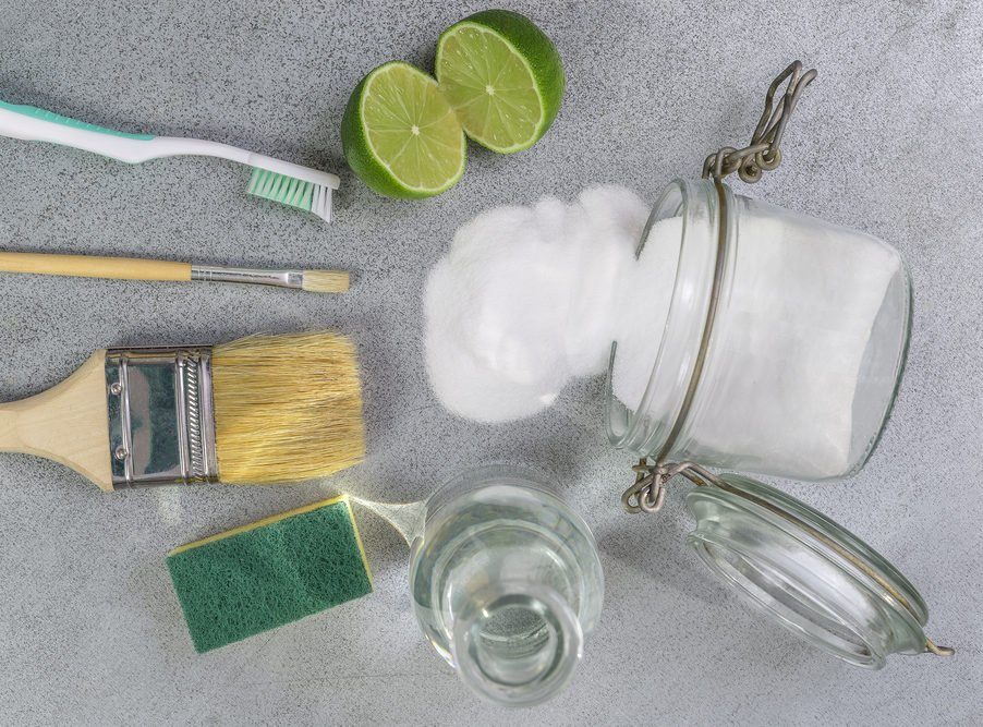 Baking soda, lemon with sponge and objects for effective and safe house cleaning