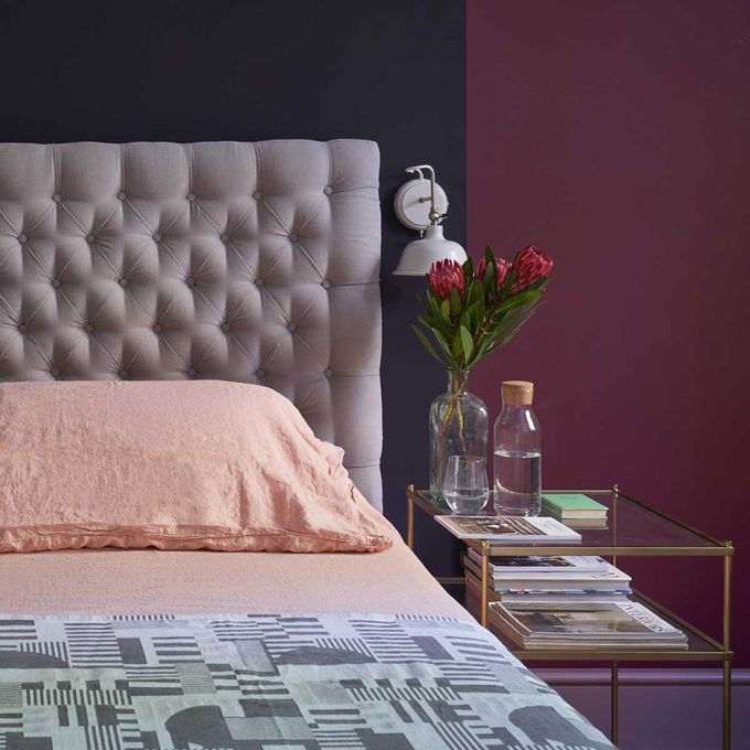 Bedroom with navy and purple walls
