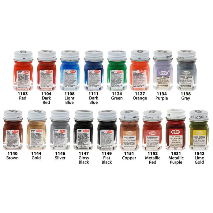 Two rows of Testors paint jars in many colors