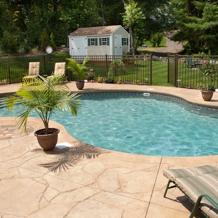 Backyard pool with fence